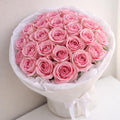 Bouquet of pink roses in white wrapping — Roses Only Winnipeg
