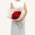 Bouquet of red roses wrapped in white paper — Roses Only Winnipeg